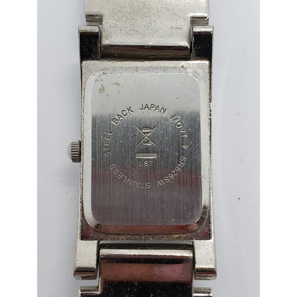 Women\'s dress watch. Silver iridescent square face. Jewels connect face to band main image 7